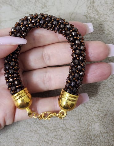 Bracelet of beads and crystals